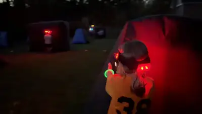 Kids playing laser tag together at an outdoor party in Montgomery County, PA