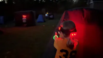 Kids playing laser tag together at an outdoor party in Montgomery County, PA