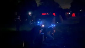 Teens playing nighttime mobile laser tag with glowing LED headbands at a 14th birthday party in Chadds Ford, PA