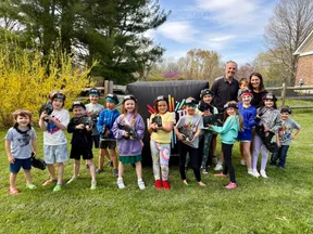 Group photo with Laser Tag Anywhere hosts and guests at an 8 year old's mobile laser tag birthday party in the Chadds Ford, PA area