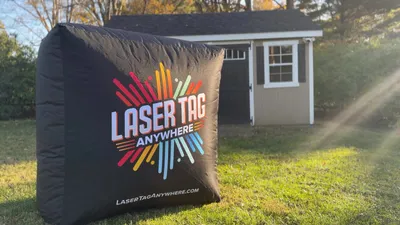 Kids running and playing laser tag at an outdoor event in Bucks County, PA