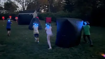 Children playing backyard laser tag at a birthday party in Delaware County, PA