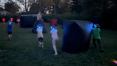 Children playing backyard laser tag at a birthday party in Delaware County, PA